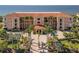 Beautiful building with a red tile roof, lush landscaping, and stunning ocean views at 95 N Marion Ct # 126, Punta Gorda, FL 33950
