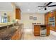 Gourmet kitchen features granite counters, custom cabinets, and under cabinet lighting at 95 N Marion Ct # 126, Punta Gorda, FL 33950