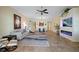 Bright and open living room featuring stylish decor and modern fireplace at 95 N Marion Ct # 126, Punta Gorda, FL 33950