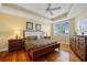 Spacious main bedroom featuring a tray ceiling, hardwood floors, and ample light at 95 N Marion Ct # 126, Punta Gorda, FL 33950