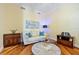 Bright office with a white couch, wood floors, modern furniture, and neutral paint at 95 N Marion Ct # 126, Punta Gorda, FL 33950