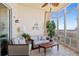 Relaxing sunroom with comfortable seating and views of the water at 95 N Marion Ct # 126, Punta Gorda, FL 33950