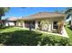 Exterior showcasing well-maintained lawn and the back side of the house at 2836 Suncoast Lakes Blvd, Punta Gorda, FL 33980