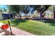 Green backyard with mature trees and landscaping at 2836 Suncoast Lakes Blvd, Punta Gorda, FL 33980