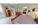 Spacious bedroom showing natural light, decor, tile floors, and ensuite access at 2836 Suncoast Lakes Blvd, Punta Gorda, FL 33980