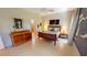 Comfortable bedroom with tile flooring, a wooden bed frame, and tasteful decor at 2836 Suncoast Lakes Blvd, Punta Gorda, FL 33980