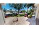 Picturesque suburban street view from the front porch of a home with beautiful landscaping and well-maintained lawns at 2836 Suncoast Lakes Blvd, Punta Gorda, FL 33980