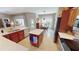 Bright kitchen with a center island, stainless steel appliances, and wood cabinetry for a modern look at 2836 Suncoast Lakes Blvd, Punta Gorda, FL 33980