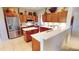 Modern kitchen featuring quartz countertops, stainless steel appliances, and ample cabinet space for storage at 2836 Suncoast Lakes Blvd, Punta Gorda, FL 33980