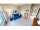 Comfortable living room featuring a blue sofa and stylish decor at 2836 Suncoast Lakes Blvd, Punta Gorda, FL 33980
