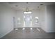 Bright foyer with tile floors and ample natural light pouring in from the front door and side windows at 10071 Sunday Dr, Port Charlotte, FL 33981