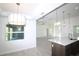 Bright, modern kitchen with large windows offers abundant natural light and views of the living space at 10071 Sunday Dr, Port Charlotte, FL 33981