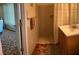 Bathroom featuring a tiled shower, vanity, and sink providing space for daily routines at 123 Poinsettia Ne Cir, Port Charlotte, FL 33952