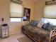 Inviting bedroom featuring daybed, neutral decor, and bedside table at 123 Poinsettia Ne Cir, Port Charlotte, FL 33952