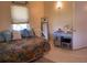 Bedroom with light walls, simple decor, and tile flooring at 123 Poinsettia Ne Cir, Port Charlotte, FL 33952