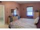 Bedroom features comfortable bedding, closet space, and natural light at 123 Poinsettia Ne Cir, Port Charlotte, FL 33952