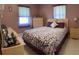 Bedroom features comfortable bedding, closet space, and natural light at 123 Poinsettia Ne Cir, Port Charlotte, FL 33952