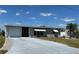Charming single story home featuring attached garage and a well maintained front yard at 123 Poinsettia Ne Cir, Port Charlotte, FL 33952