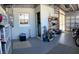 Spacious garage with storage shelves and motorcycle offers room for hobbies and organization at 123 Poinsettia Ne Cir, Port Charlotte, FL 33952