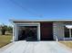 Open garage showcasing storage capabilities and accessibility from the driveway for easy access at 123 Poinsettia Ne Cir, Port Charlotte, FL 33952