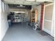 Spacious garage with storage and an open ceiling at 123 Poinsettia Ne Cir, Port Charlotte, FL 33952
