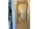 Tiled hallway that leads to additional rooms and bath at 123 Poinsettia Ne Cir, Port Charlotte, FL 33952