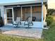 Screened lanai features comfortable seating and a tranquil outdoor space at 123 Poinsettia Ne Cir, Port Charlotte, FL 33952