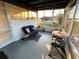 Enclosed lanai with comfortable seating and views of the water at 123 Poinsettia Ne Cir, Port Charlotte, FL 33952
