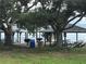 Outdoor park featuring picnic tables and barbeque grills, perfect for gatherings at 123 Poinsettia Ne Cir, Port Charlotte, FL 33952