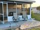 Covered patio with outdoor seating and a view of the home at 123 Poinsettia Ne Cir, Port Charlotte, FL 33952
