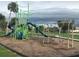 Bright and colorful playground at Port Charlotte Beach Park, complete with slides and swings for enjoyment at 123 Poinsettia Ne Cir, Port Charlotte, FL 33952
