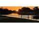 Breathtaking sunset over the tranquil canal, perfect for evening relaxation at 123 Poinsettia Ne Cir, Port Charlotte, FL 33952