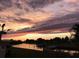 Colorful sunset over the canal, creating a beautiful and serene atmosphere at 123 Poinsettia Ne Cir, Port Charlotte, FL 33952