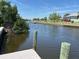 Scenic waterfront view showcases direct access to the canal, promising a tranquil and picturesque setting at 123 Poinsettia Ne Cir, Port Charlotte, FL 33952