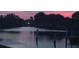 Tranquil waterfront view at twilight, reflecting the calm and peaceful surroundings at 123 Poinsettia Ne Cir, Port Charlotte, FL 33952