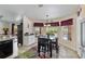 Cozy dining area with bay windows, views of the pool, and colorful rug at 1240 Alpinia Rd, North Port, FL 34288