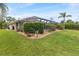 The home features meticulous landscaping and lawn care, providing an appealing outdoor space at 1240 Alpinia Rd, North Port, FL 34288