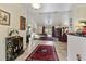 Spacious living room with tile floors, complemented by stylish rugs and comfortable seating at 1240 Alpinia Rd, North Port, FL 34288