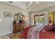 Spacious primary bedroom with tray ceilings and sliding door access to the lanai at 1240 Alpinia Rd, North Port, FL 34288