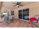 Covered patio featuring outdoor seating, tile flooring, and views of the pool at 1240 Alpinia Rd, North Port, FL 34288