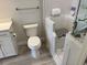 Accessible bathroom with a walk-in tub, handrails, toilet, and vanity at 1263 Cicely Ct, North Port, FL 34289