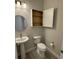 Bathroom with neutral paint, pedestal sink, and white toilet at 1263 Cicely Ct, North Port, FL 34289