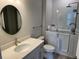 Accessible bathroom with a walk-in tub, vanity, toilet, towel bar, and modern fixtures at 1263 Cicely Ct, North Port, FL 34289