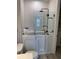 Bathroom features a walk-in tub, shower head, toilet, and open shelf at 1263 Cicely Ct, North Port, FL 34289