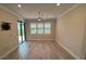 Large bedroom with window and sliding glass doors to the back patio at 1263 Cicely Ct, North Port, FL 34289