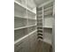 Custom closet with plenty of shelving and drawer space at 1263 Cicely Ct, North Port, FL 34289