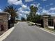 View of the secure, gated community entrance and private road at 1263 Cicely Ct, North Port, FL 34289