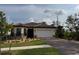 Beautiful single-story home with a well-manicured lawn and paver driveway at 1263 Cicely Ct, North Port, FL 34289