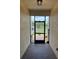 View of a screened front porch with brick-paved flooring at 1263 Cicely Ct, North Port, FL 34289