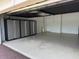 Spacious garage with epoxy flooring and ample storage cabinets at 1263 Cicely Ct, North Port, FL 34289